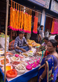 People at market stall