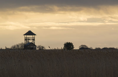 Scenic view of landscape against sky at sunset