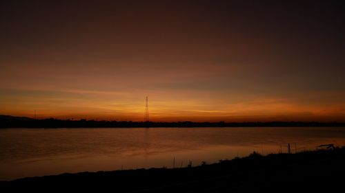 Scenic view of silhouette landscape against romantic sky at sunset