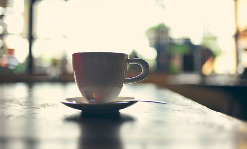 Close-up of coffee cup on table