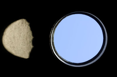 Low angle view of sky seen through glass window