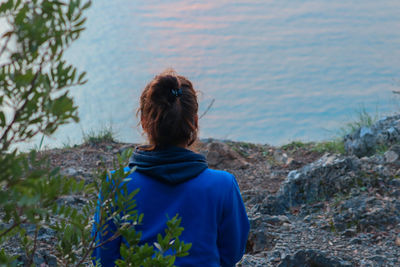 Rear view of woman looking at sea