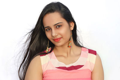 Portrait of a beautiful young woman over white background