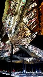 Low angle view of illuminated ceiling at night