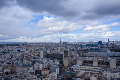 High angle view of city against cloudy sky