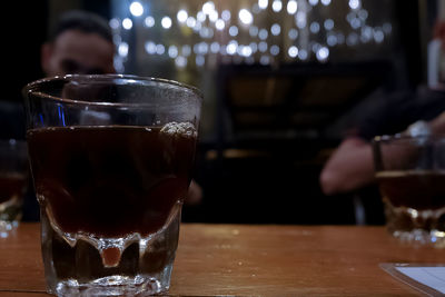 Close-up of beer glass on table