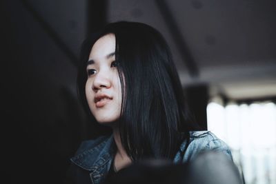 Portrait of young woman looking away