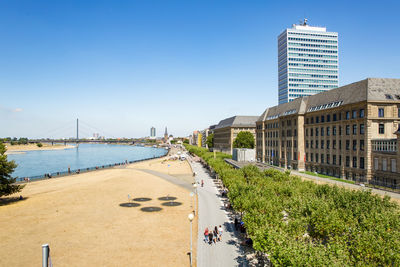 View of city buildings against clear sky