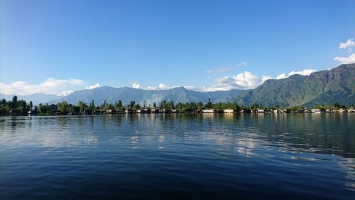 Scenic view of lake against blue sky