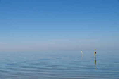 Scenic view of sea against blue sky