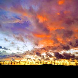 Low angle view of dramatic sky during sunset