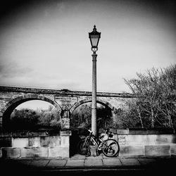 Street light parked against sky