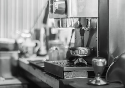 Making coffee concept. black and white close up detail with modern cafe machine.