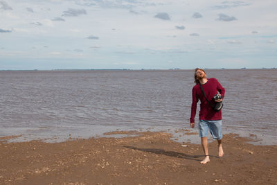 Photographer tourist near the sea