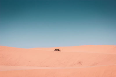 Scenic view of desert against clear sky