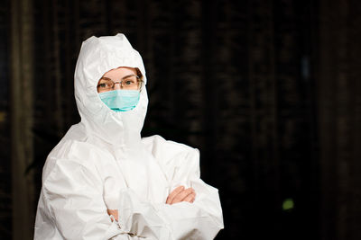 Portrait of woman wearing hazmat suit