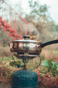 Close-up of old rusty car on field