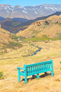 Empty bench in a field