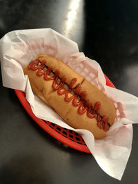 Close-up of hand holding hot dog