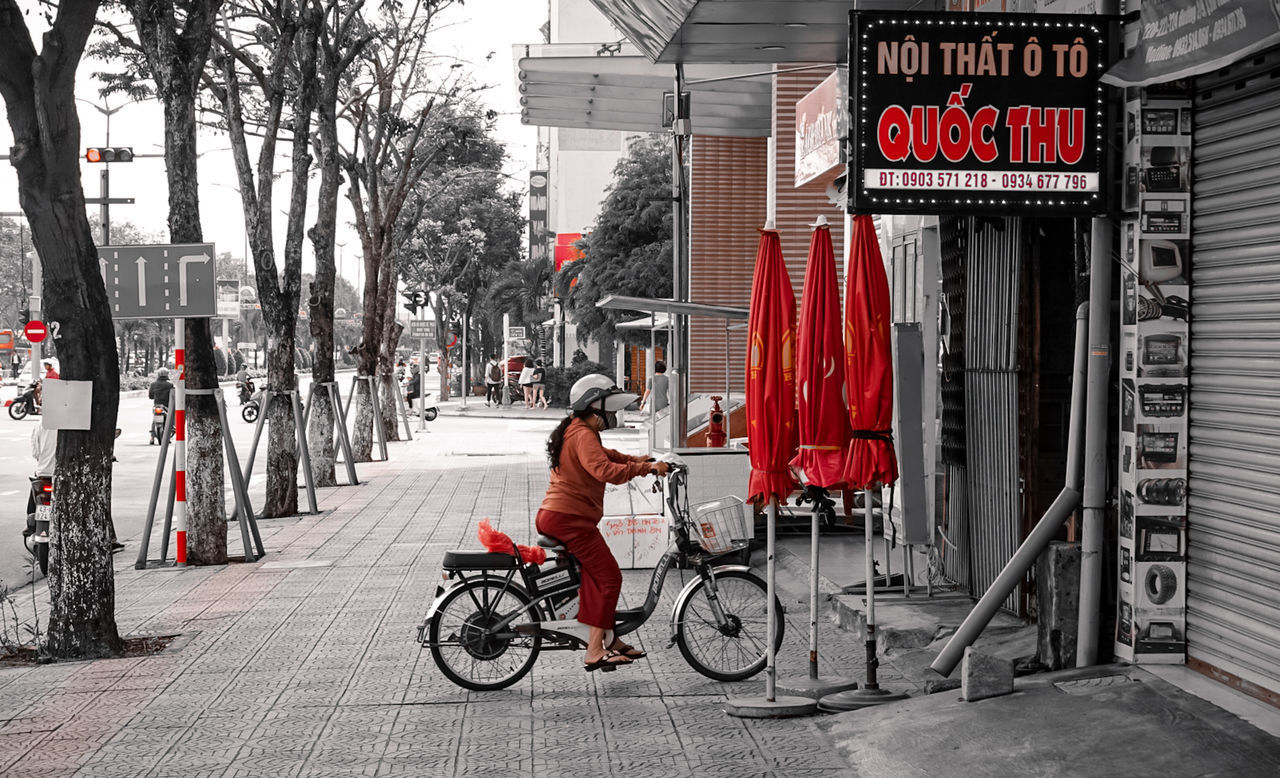 MAN RIDING BICYCLE ON FOOTPATH