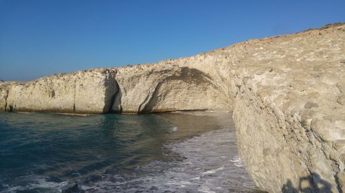 Scenic view of sea against clear blue sky