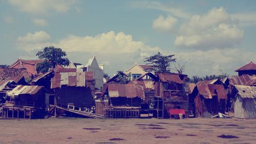 Buildings on beach against sky