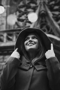 Close up happy positive lady in stylish coat monochrome portrait picture