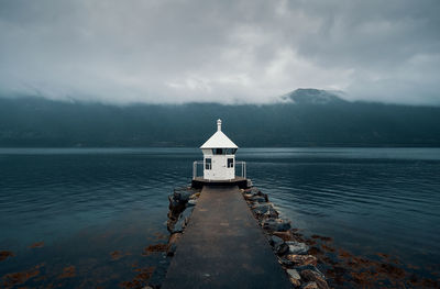 Lighthouse inside a fjord on a rainy day, norway