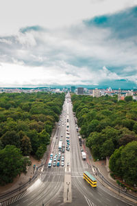 High angle view of traffic on road against cloudy sky