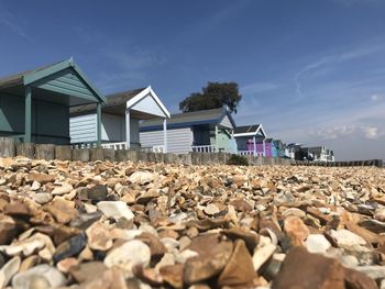 Houses on shore against sky