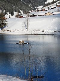 Alpine huts on a lovely lake