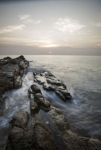 Scenic view of sea against sky during sunset