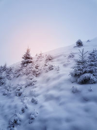 Snow covered mountain against sky during winter