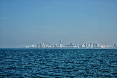 Scenic view of sea against clear blue sky