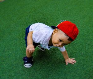 High angle view of boy on grassland