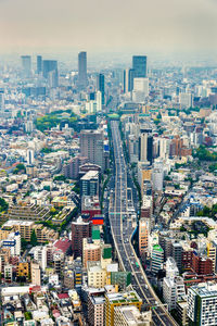 Aerial view of modern buildings in city against sky