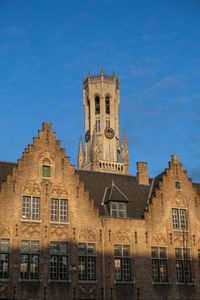 Low angle view of building against blue sky