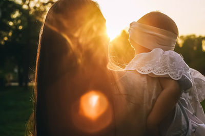 Close-up of woman with balloons