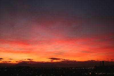 Scenic view of silhouette landscape against romantic sky at sunset