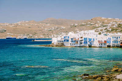 View of sea against buildings