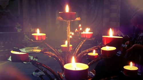 Close-up of lit tea light candles