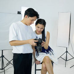 Young couple looking at camera