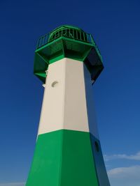 Low angle view of lighthouse against clear blue sky