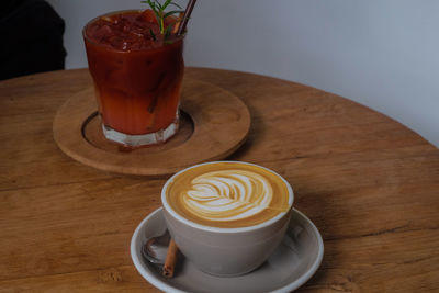 Close-up of cappuccino served on table