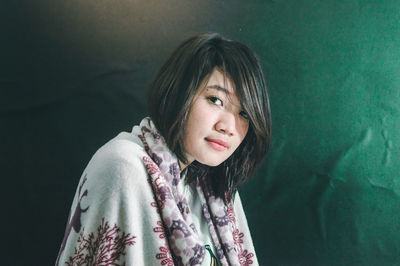 Close-up portrait of young woman standing outdoors