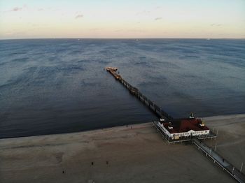 High angle view of pier over sea against sky