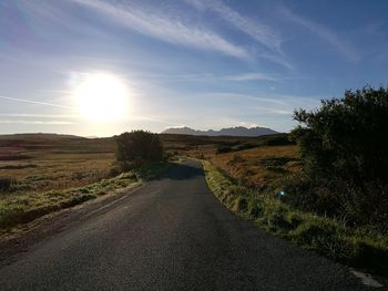 Road amidst landscape against sky