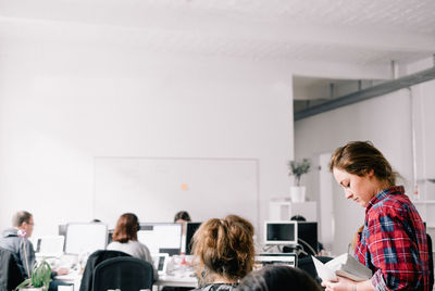 Interior of business people working in open office