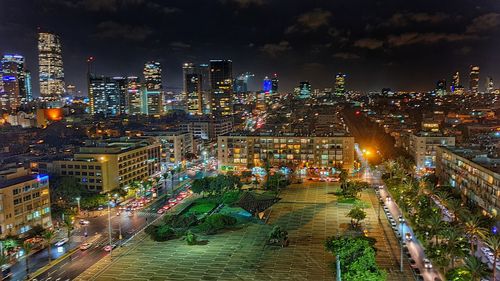 High angle view of illuminated city buildings at night