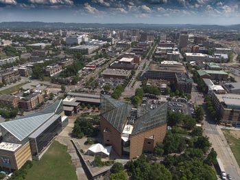 High angle view of city buildings against sky